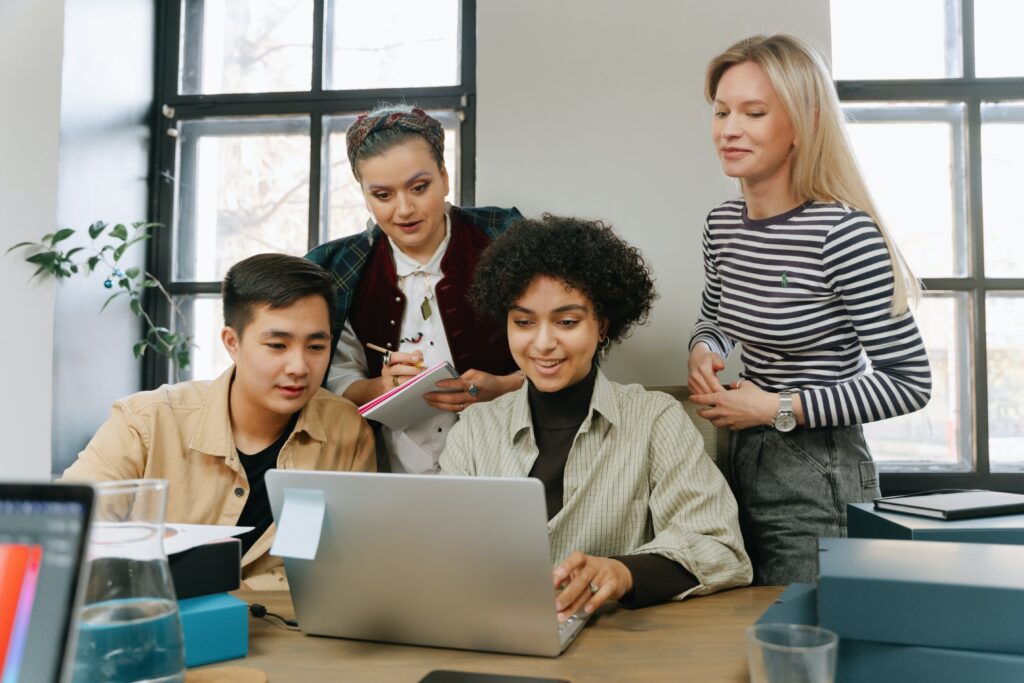 coworkers working on the companys marketing strategy. scaled
